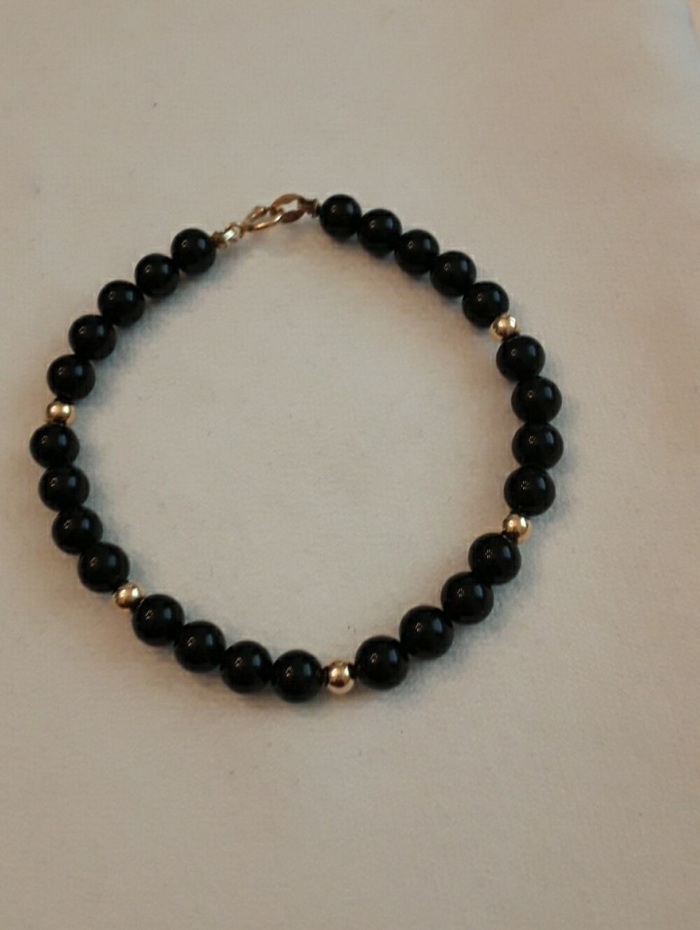 Onyx bead with 14k beads and clasp bracelet